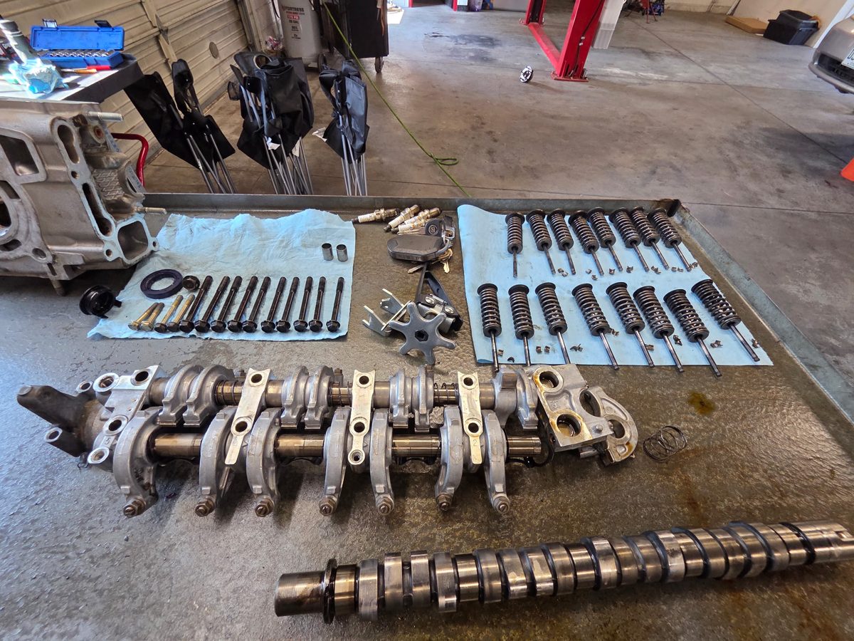 Engine internals laid out during a rebuild